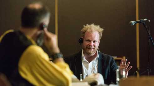 Actor Andreas Tschernek in coversation with renowned Czech economist Tomáš Sedláček.