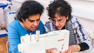 Blogger Lydia and her helper at the sewing table.
