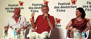 Rudolf Thome (Mitte) mit Esther Zimmering und Josef Schnelle beim Filmgespräch zu Ins Blaue, Festival des deutschen Films, 2013