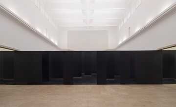 An optical illusion confronts visitors as they enter the pavilion: the wall that seems to be blocking their way is actually dozens of individual, offset panels.