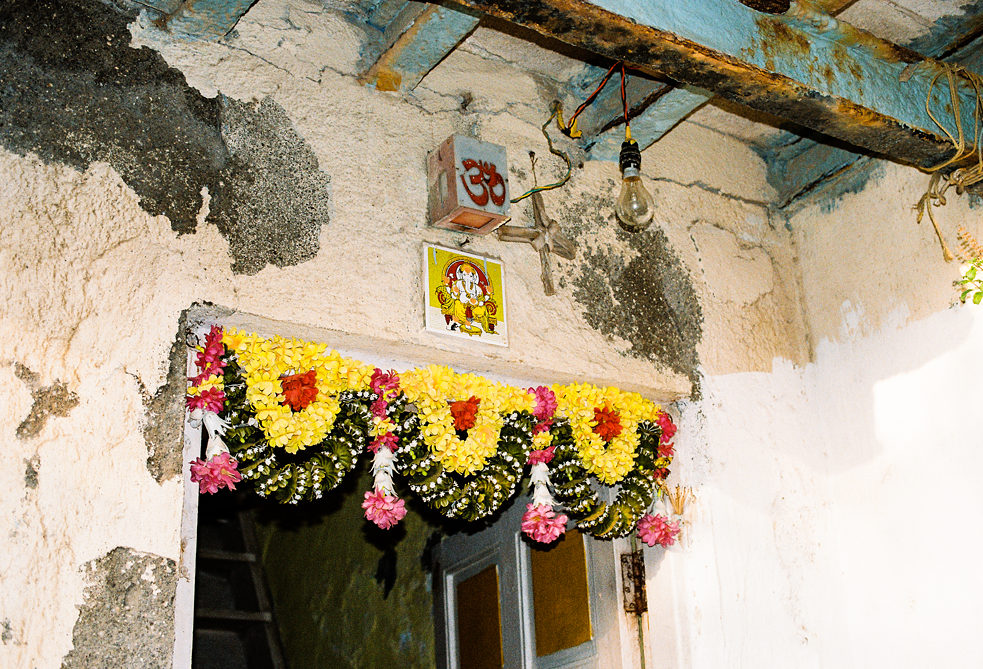 Entrance to the house of a Hindu Koli family with Ganpati, the elephant god, and the ‘om’ symbol above the threshold.
