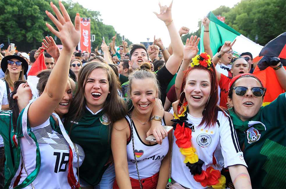For many football fans, wearing Germany’s national colours is just part of the fun and has nothing to do with xenophobia or exclusion - but criticism is growing.