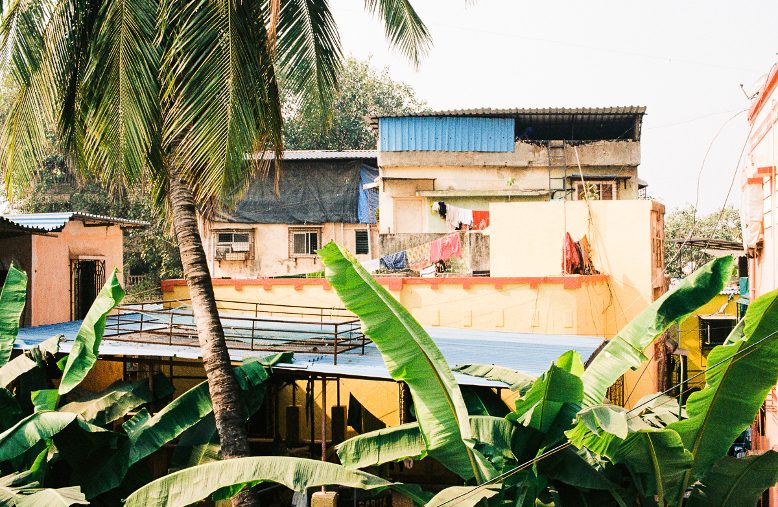 View from a high-rise looking out over the roofs of the city to the sea