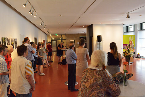 The audience listens attentively.