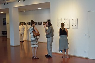 Guests discussing the images of the students.