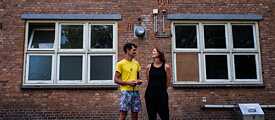 Marcel and Maartje in front of the former dormitories of the "Blitzmädel".