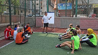 Hiba El Jaafil gives the 12 coaches of the Soccer Camp an introduction to the football3 method
