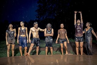 Youngsters after a battle in the mud during monsun