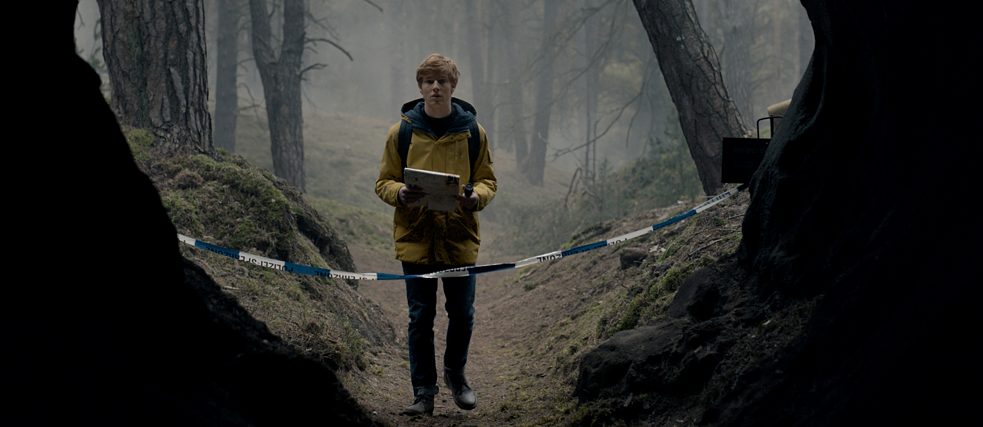 Dark production still - Jonas at the entrance of the cave