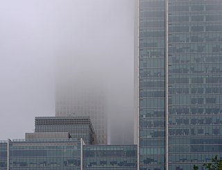 Canary Wharf the city disappearing in fog and glass