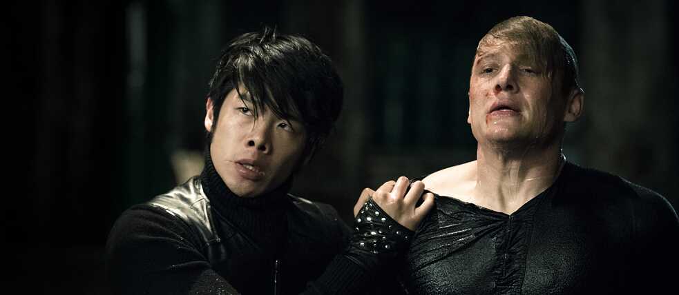 Still from You are Wanted – Season 2, Episode 1: No mercy: Lukas is tortured by an asian gang member to give up "Burning Man"