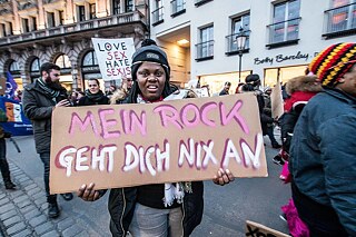 Protests on International Women’s Day, 8 March 2018, in Munich. The sign reads, “My skirt is none of your business.” 