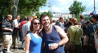 An Australian friend and I watching the parade. He inadvertently contributed to the festivities by wearing the Australian national dress. 