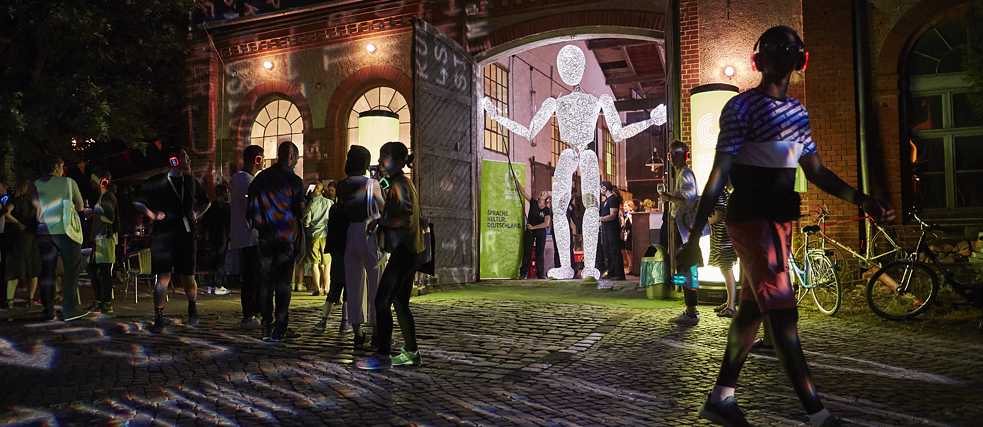 The Giant Dundu, an illuminated limb figure, during the opening evening at the E-Werk Weimar