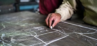 Kreidezeichnungen auf einer Schieferntafel