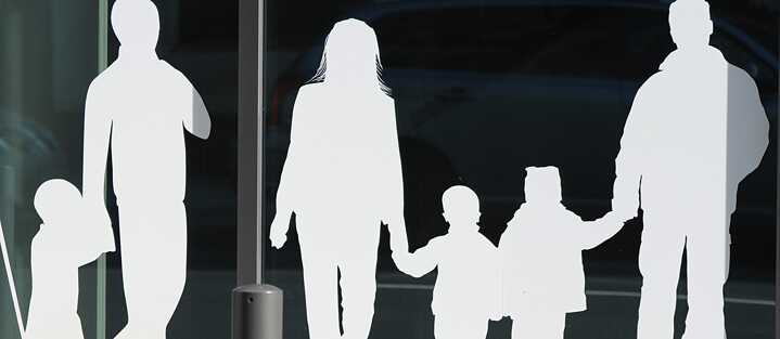 Figures of a father with child and a family with children - glued to the building of the German Federal Ministry for Family Affairs, Senior Citizens, Women and Youth