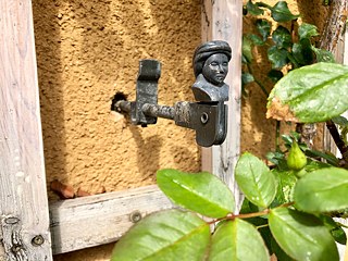The Garden City was meticulously designed down to the smallest of details, like the decorative shutter dog pictured here. 