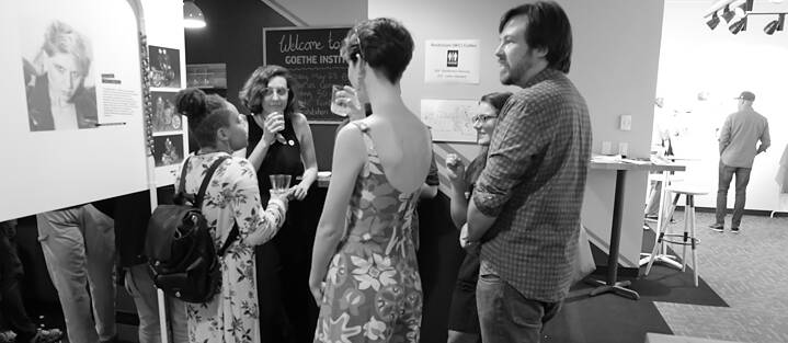 Our local curator, Mary Claire Phillips, discussing the exhibit with guests at the opening