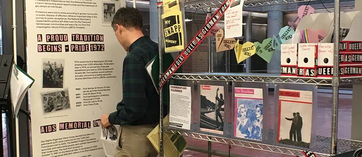 Exhibit pieces and guests at the mini exhibit at the DC Center for the LGBT Community