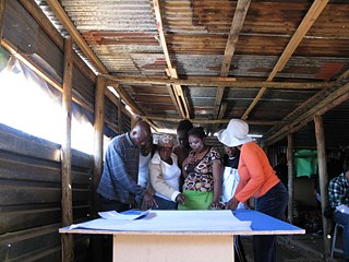 The group of community architects and Ruimsig residents who assisted students in measuring the settlement.