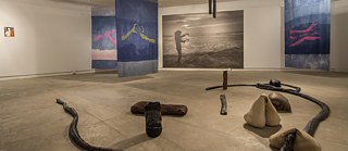 Exhibition view with pieces by Lucas Odahara: Lingual (descending), The Many Headed Hydra: 3 Oracle flags, 2017, and We are from here, from the Sea, 2019