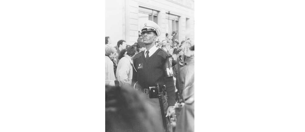 On November 10, the American military policeman stoically watches over his Allied border checkpoint "Checkpoint Charlie".