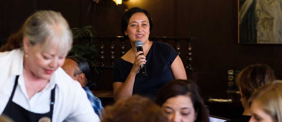Institute director Lien Heidenreich-Seleme welcomes guests to the sneak peek in Los Angeles