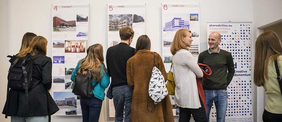 Visitors inside the exhibition "Iconic Ruins" in Prague