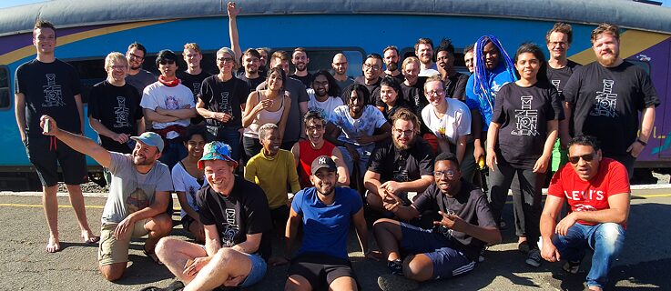 The A Maze Train Jam 2019 participants in front of the train