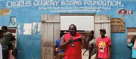 Scene in front of the Charles Quartey Boxing Foundation from the film “Lionhearted” 