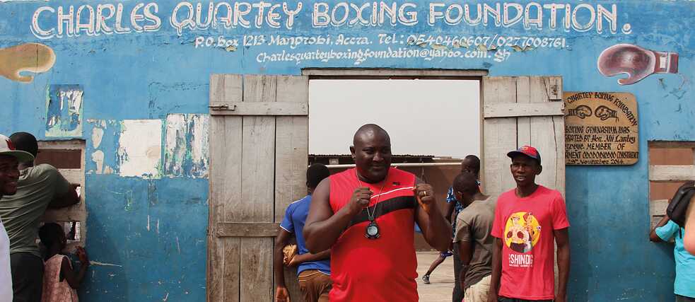 Scene in front of the Charles Quartey Boxing Foundation from the film “Lionhearted” 