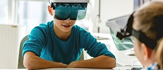 young boy with VR glasses