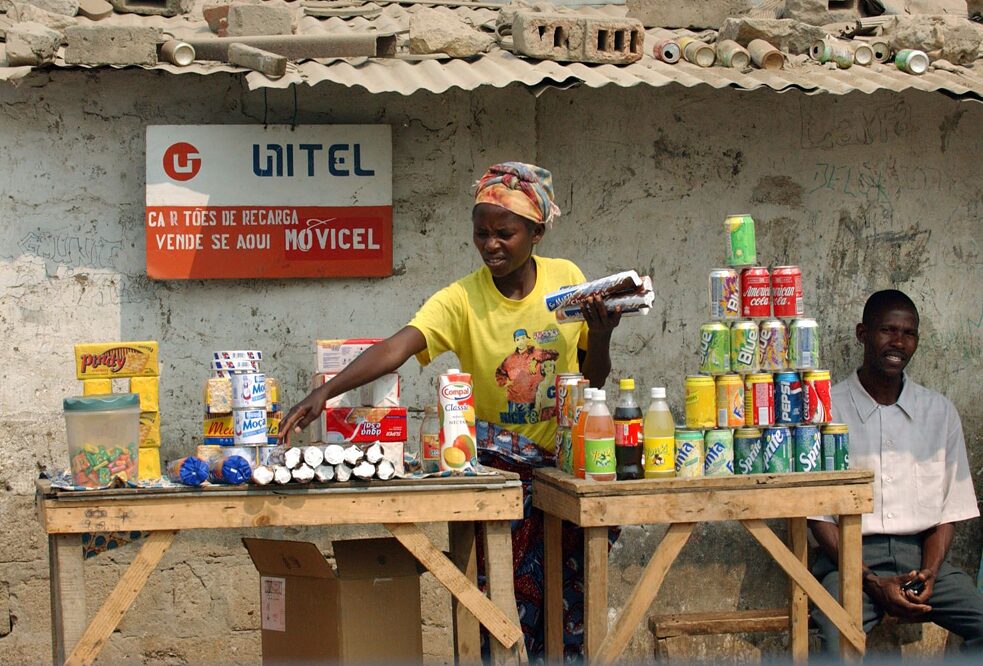 A woman sorts goods at her stand in Angola's capital Luanda.