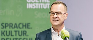 Klaus Krischok talks at the 25th anniversary