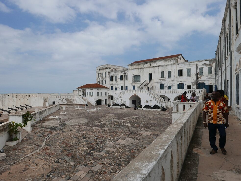 Colonial history: Colonial history: The Cape Coast Castle on the coast of Ghana served as an important base for the slave trade. Today the former fortress is a large museum on the history of the slave trade on the former Gold Coast and since 1979 a UNESCO World Heritage Site. On the Gold Coast of West Africa, Denmark maintained numerous bases and fortresses in the 17th and 18th centuries, which are collectively known as the Danish Gold Coast and Danish Guinea respectively. Cape Coast Castle is one of about 35 historic forts on the Ghanaian coast. Like most other forts on the so-called "Gold Coast", Cape Coast Castle served as a prison for locals who were captured for sale and transport as slaves to the European colonies in North and South America according to Wikipedia. In the basement dungeons of the fort, they often had to wait for months for the next slave ship before they were finally brought to the beach through a narrow cellar corridor for loading. 