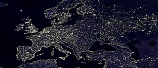 Human-made lights highlight particularly developed or populated areas of the Earth's surface, including the seaboards of Europe.
