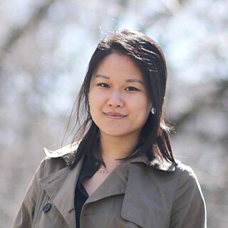 Portrait of Karen Hoa outside, she has black hair and is smiling