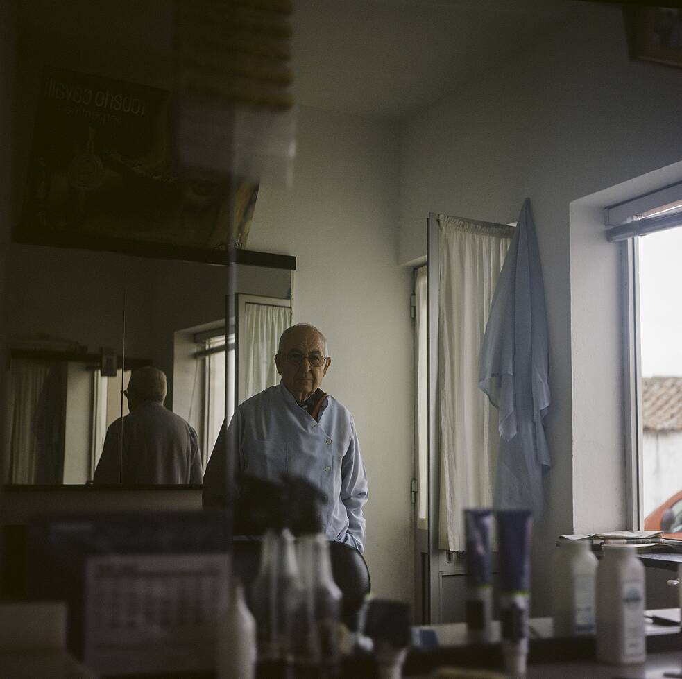 Senhor Martins in seinem Frisörladen