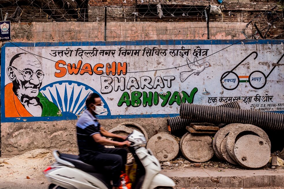 Tricolour advertisements were painted around cities in India to promote action and awareness during the Clean India Campaign (or Swachh Bharat Abhiyaan) between 2014 and 2019. What commands attention here is the ironic juxtaposition of abandoned supplies on the sidewalk by the poster urging to keep it clean.