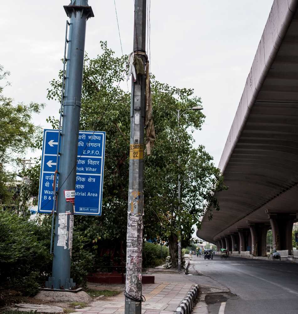 Cleverly hidden behind electric poles and trees, what secrets do these boards behold?