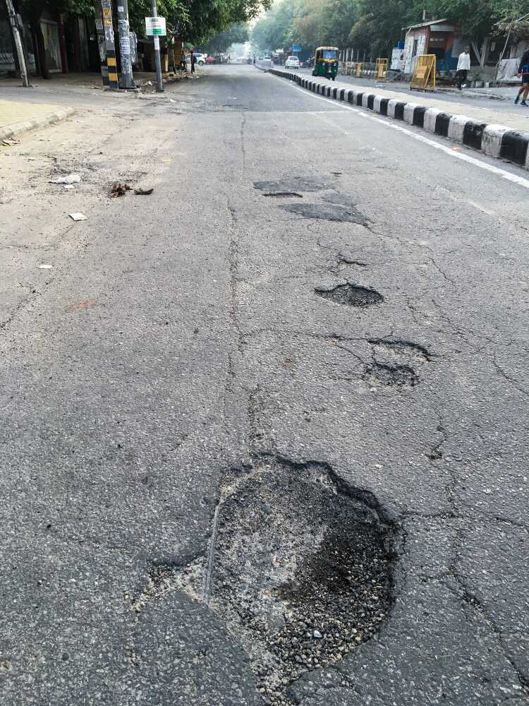 Craters and eruptions in the middle of roads and pavements add a little zing to the travellers’ rides. Similar to ones on the lunar surface, dents and disturbances on the paths in Delhi stay put for a long time.