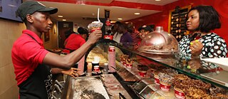 Racism – More modern than the West would like to see? - Nigeria today: Customers buy  ice cream in Lagos. Years of solid economic growth, gradual economic reforms and energy discoveries have transformed Africa into one of the worlds hottest markets.