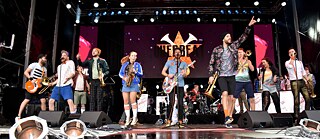 Many bands who sing in the Kölsch dialect have enjoyed national success, like the 13-piece brass-pop Querbeat band on tour here. 