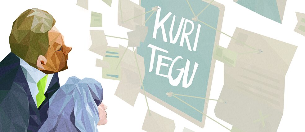 Eine Frau und ein Mann schauen auf eine Texttafel mit dem Schriftzug Kuri tegu.