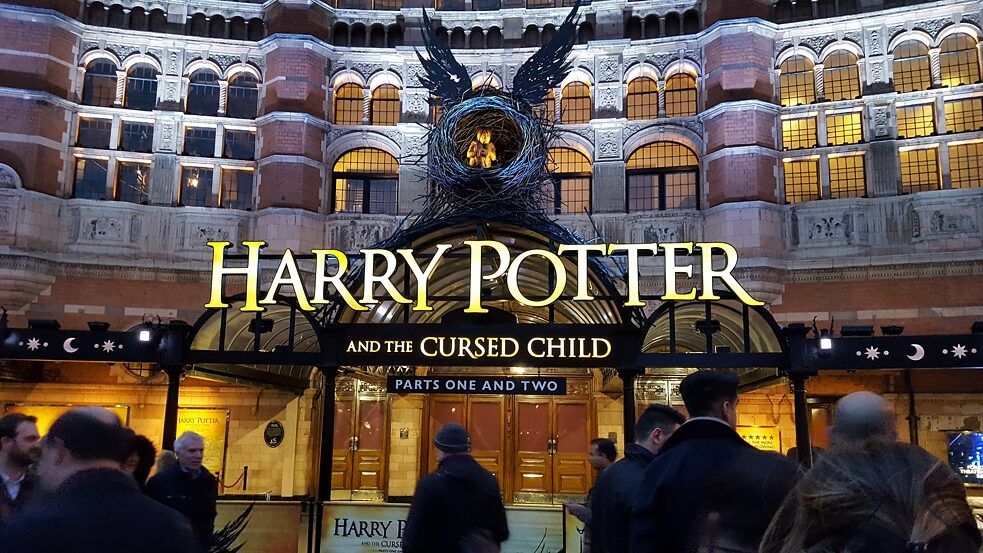 People gather at a performance of Harry Potter at Palace Theatre, London