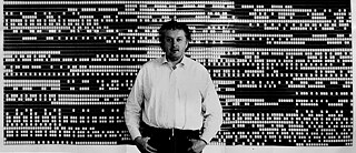 Peter Kubelka in front of a visual depiction of his film "Arnulf Rainer"