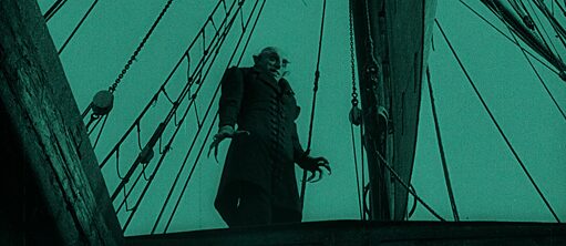 A vampire stand on deck of an old sailing boat