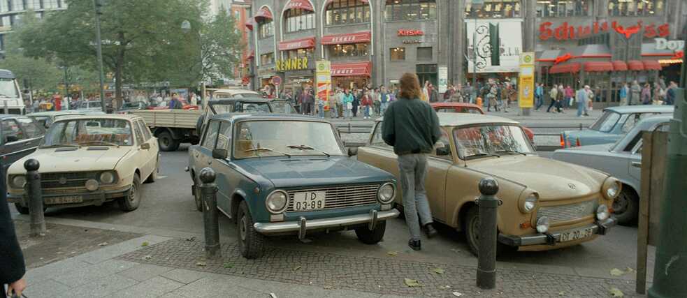 “East Germans weren’t forced to conform to the West; they wanted to”: On the day after the Wall came down, thousands of East Berliners flocked to Kurfürstendamm in West Berlin (Cars from East Germany on Breitscheidplatz, 10 November 1989).