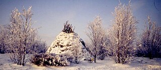 Small conical hut in the snow