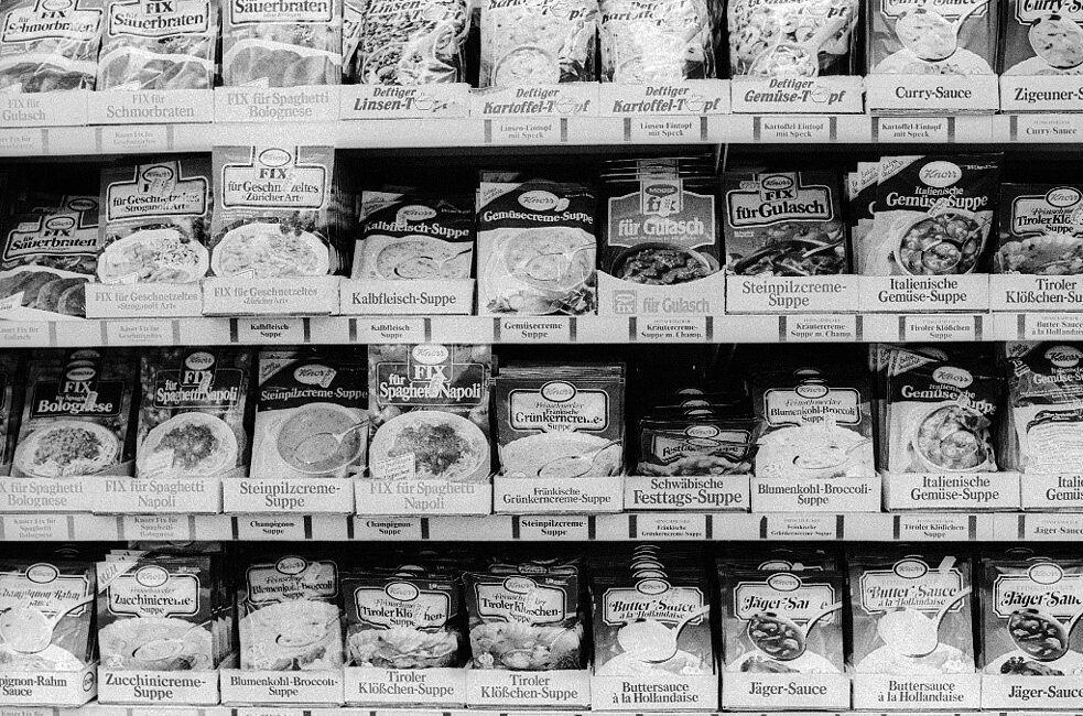 A supermarket shelf full of soups